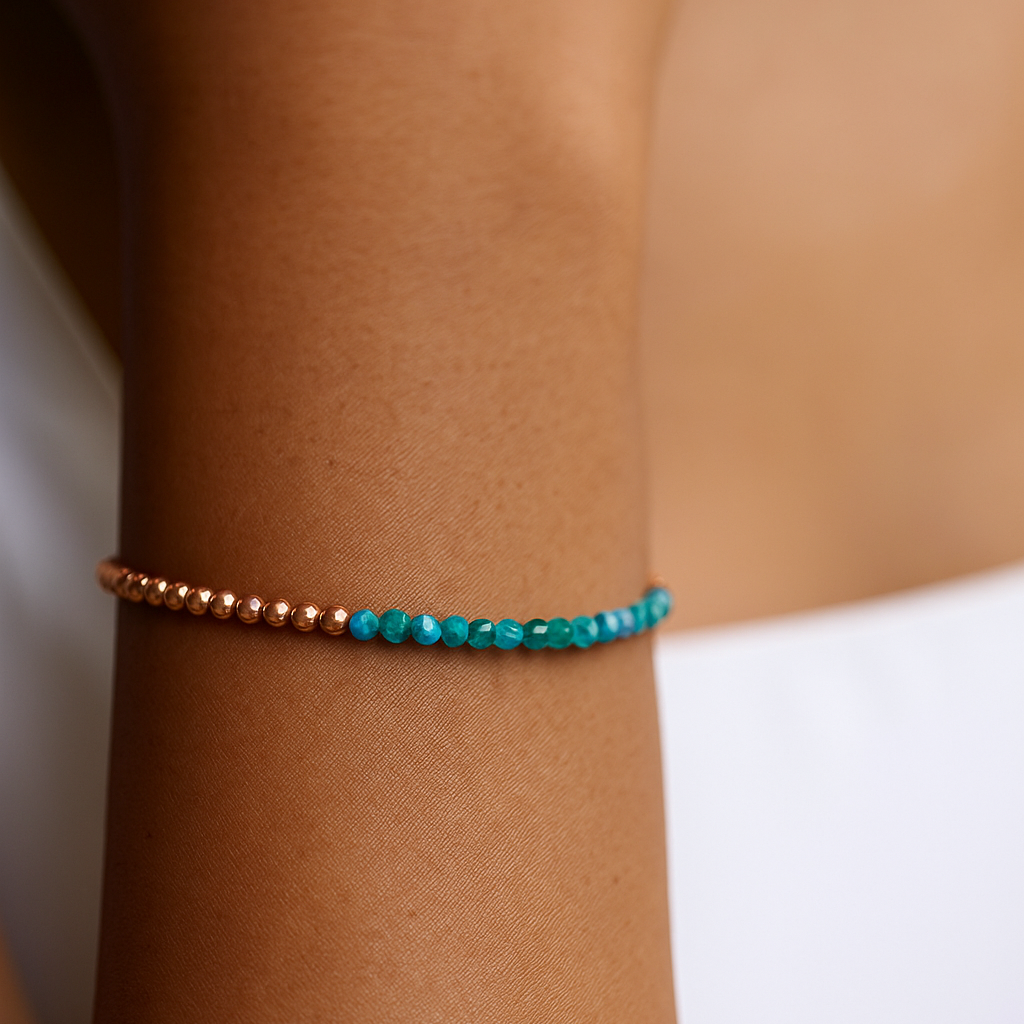 Blue apatite faceted beaded bracelet on a wrist with a natural background 
