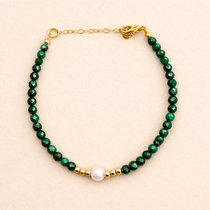 Malachite is a vivid, opaque gemstone defined by its intense green color